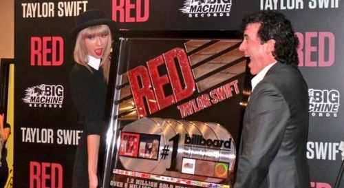 Taylor Swift is honored by Big Machine Label Group President and CEO Scott Borchetta for her multi-platinum album RED at a special event during the final 3 nights of her sold-out North American tour on September 19, 2013 at the Bridgestone Arena in Nashville, Tennessee.
